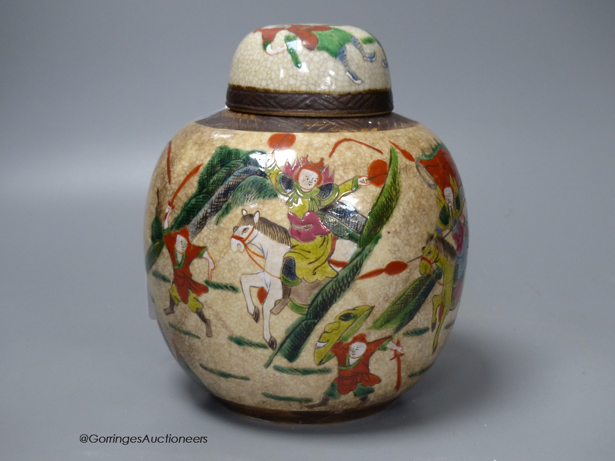 An early 20th century Chinese famille rose crackle glaze jar and cover, 20cm high